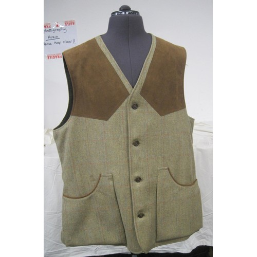 74 - A 100% Harris Tweed shooting jacket marked as size 42L in apparently unworn condition, no tags, plus... 