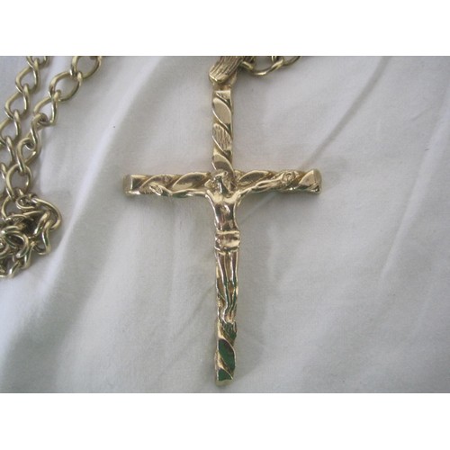 69 - A heavy 9 carat gold crucifix with figural Christ, 3 1/2