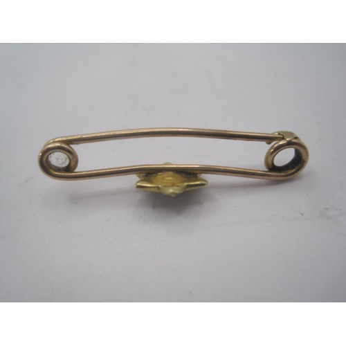 155 - A yellow metal (tests as 9 carat gold) bar brooch with star design decorated with seed pearls, appro... 