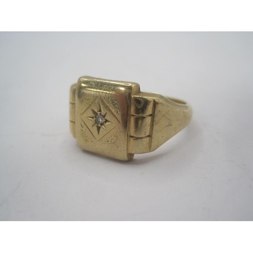 158 - A 9 carat gold gentleman's signet ring, the face set with a diamond in a starburst engraving, UK hal... 