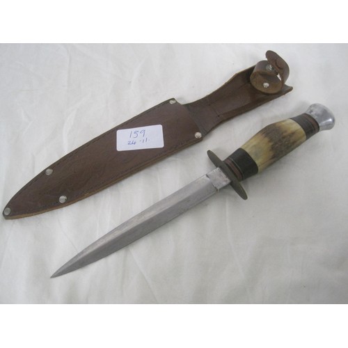 139 - An imposing bone-handled sheath knife with a blade reminiscent of a Fairburn-Sykes, in very good ord... 