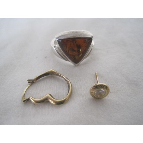 166 - A sterling silver ring set wtih what appears to be amber and a pair of individual earrings marked as... 