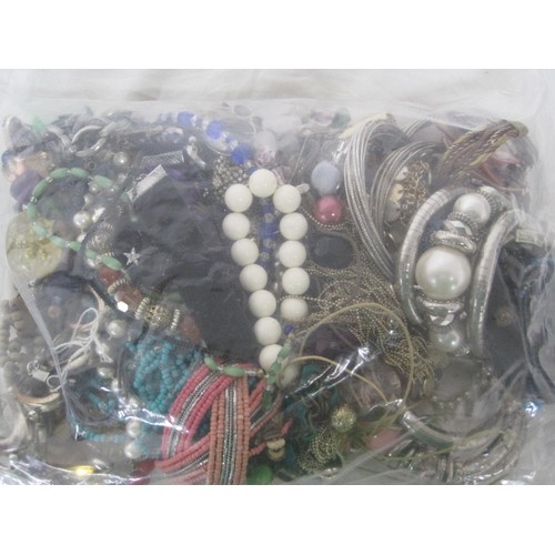 183 - A bag of assorted costume jewellery, mainly necklaces and bangles