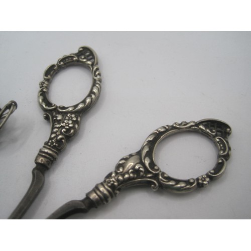 190 - A set of sterling silver scissors in silver case for chatelaine, floral repousse decor with blank ca... 