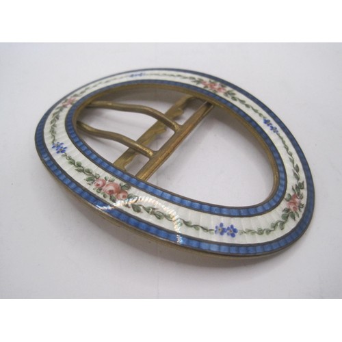 192 - A brass belt buckle with gilted finish to reverse, the face with delicate floral enamelling between ... 