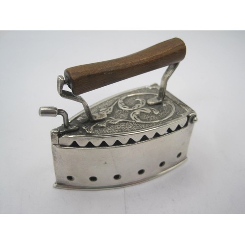 194 - A sterling silver pot pourri in the form of a flat iron with small, carved wooden handle, UK import ... 