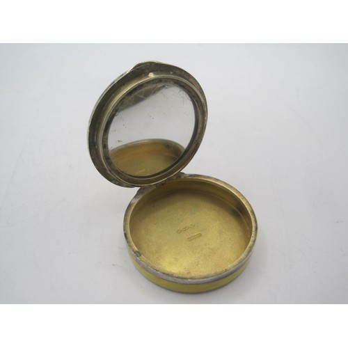 204 - A sterling silver and yellow enamel pill pot or miniature compact, import hallmarks circa 1930, a ve... 