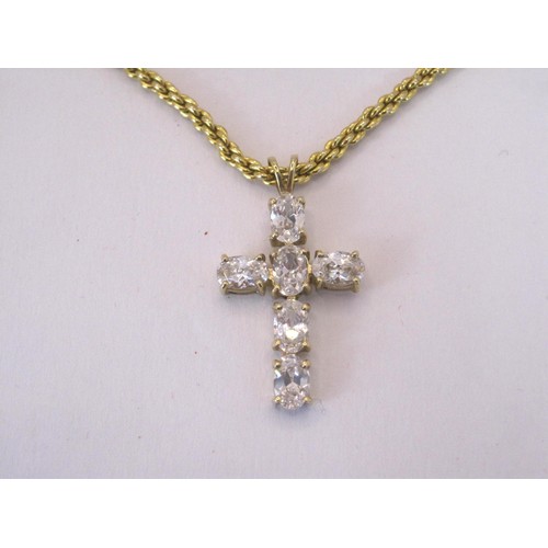 222 - A gold cross with white stones attached to a gold coloured chain.