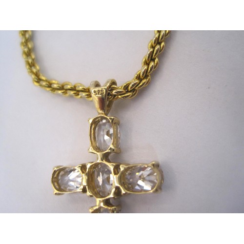 222 - A gold cross with white stones attached to a gold coloured chain.