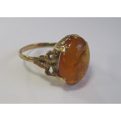 99 - A boxed 9 carat gold amber set ring hallmarked for Birmingham 1979, ring size P, approx weight 2.9g