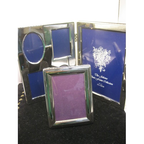 229 - A pair of silver plated photo frames, boxed, in excellent condition and apparently unused