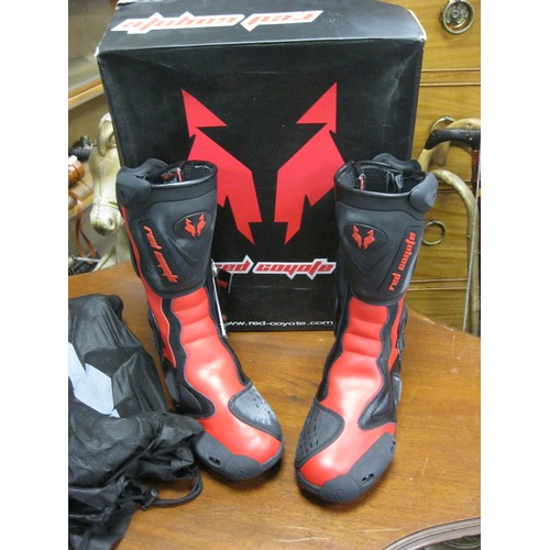 132 - A pair of red motorcycling boots, boxed and unworn, size