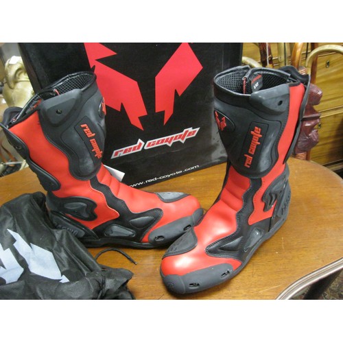 132 - A pair of red motorcycling boots, boxed and unworn, size