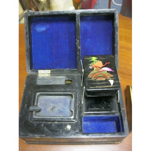 6 - An Oriental style musical smoker's box with ashtray and cigarette dispenser plus a small Oriental st... 