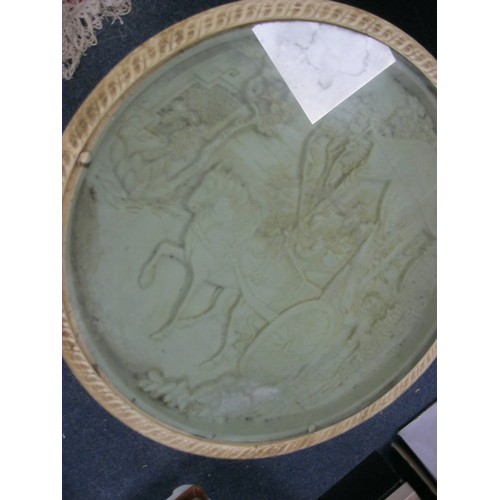 131 - An Indian style resin circular side table, the glass top enclosing relief moulded carriage scene, th... 