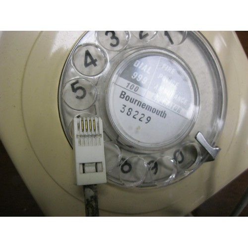 171 - A vintage rotary dial telephone in ivory white