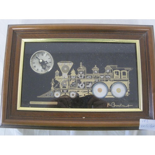 183 - A Ken Broadbent clock, framed and glazed, featuring an American locomotive made from watch parts, in... 