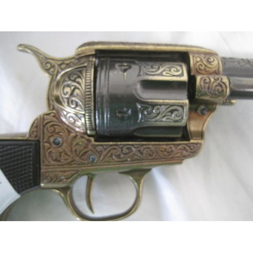 55 - A replica Colt Army with gold coloured finish in a tooled leather Western rig holster with belt, the... 