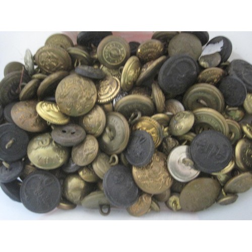 88 - A tub of various brass military buttons together with sew on patches and badges and a camo covered h... 