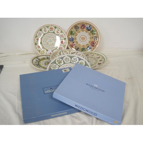 124 - A large collection of Wedgwood picture plates, mainly year plates, all boxed and in excellent order