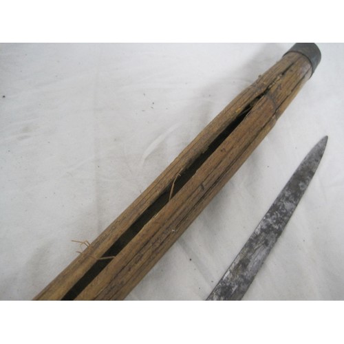 179 - An antique sword stick with bamboo shaft, the blade of good quality and egraved with floral decor an... 