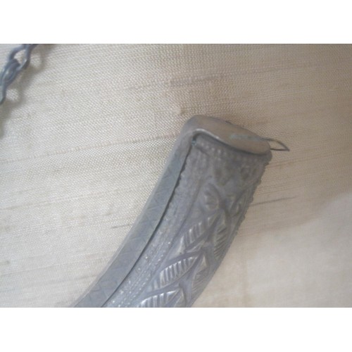 59 - A framed and glazed Omani Arabian dagger in scabbard, believed to be silver, mounted on a silk backi... 