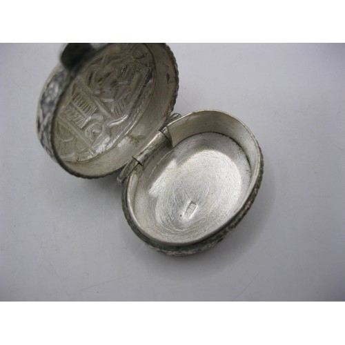 233 - A sterling silver snuff- or pill-box, Mexican silver, with Inca-style decoration to top and sides, h... 