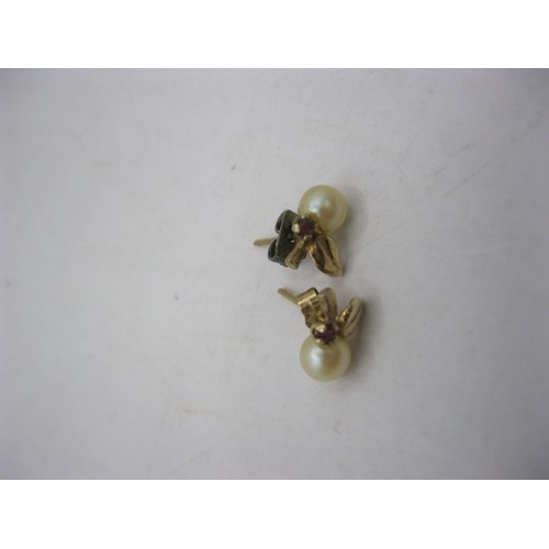 239 - 3 pairs of 9 carat gold earrings: 1 pair ball studs, 1 pair set with pearls and one pair with red st... 