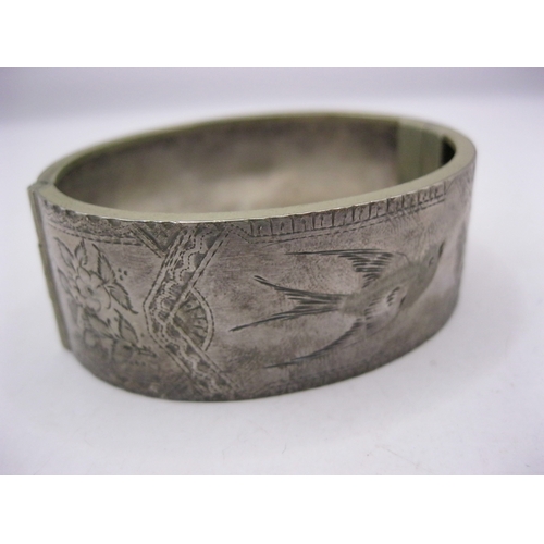 274 - A sterling silver bangle with Oriental design engraved, approx weight 26g