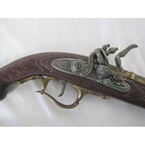 287 - A pair of heavy reproduction flintlock pistols in good order