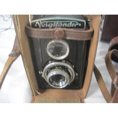 8 - Three vintage cameras in a vintage leather camera case - Voigtlander Brilliant, Diax-L-1, and a Yash... 