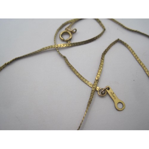 205 - A 9 carat imported gold flat snake link neck chain, gross weight approx. 1.5g, length about 37cm. St... 