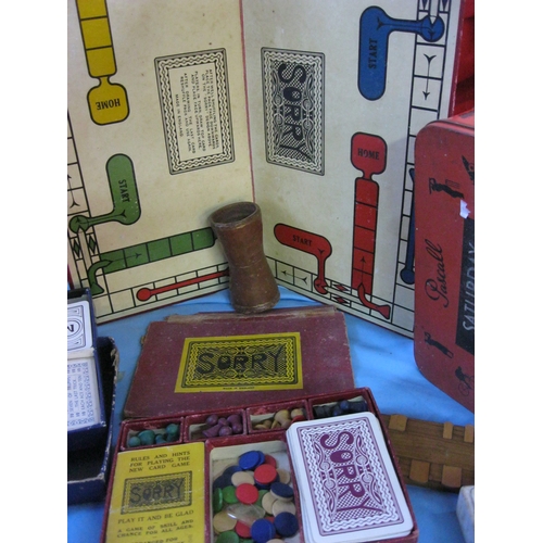 15 - An assortment of vintage games including Sorry with board and box, Bezique, wooden draughts, cards, ... 