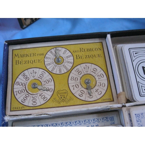 15 - An assortment of vintage games including Sorry with board and box, Bezique, wooden draughts, cards, ... 