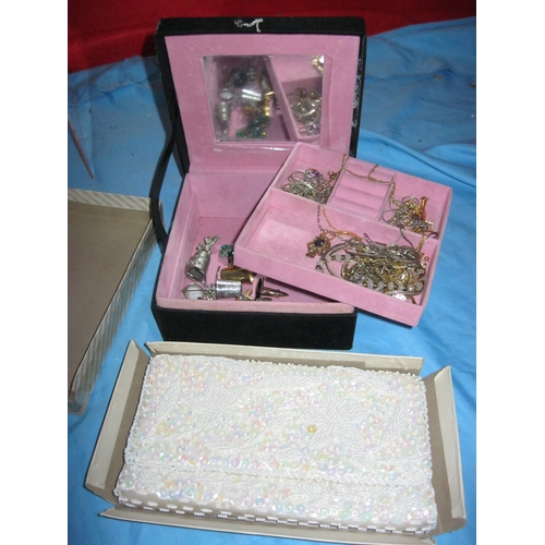 32 - A vintage jewellery box and contents plus a boxed beaded purse