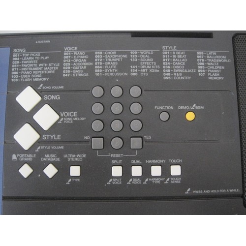 292 - A Yamaha PSR-E333 electronic keyboard with power adaptor, stand and Absolute Beginners Keyboard book