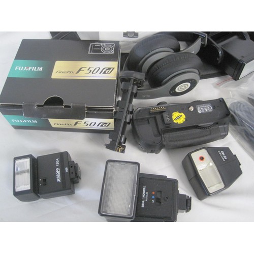 102 - A Fuji Finexpix compact camera, assorted camera flashes and accessories, an 8GB memory card etc, in ... 