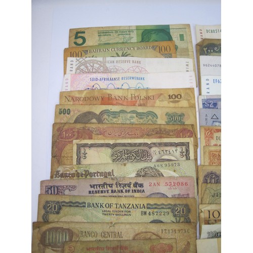 116 - About twenty-seven world banknotes including India, Belgium, South Africa, Pakistan, Bulgaria, Indon... 