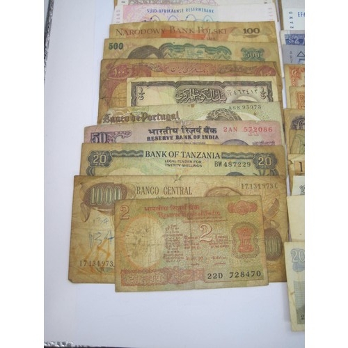 116 - About twenty-seven world banknotes including India, Belgium, South Africa, Pakistan, Bulgaria, Indon... 