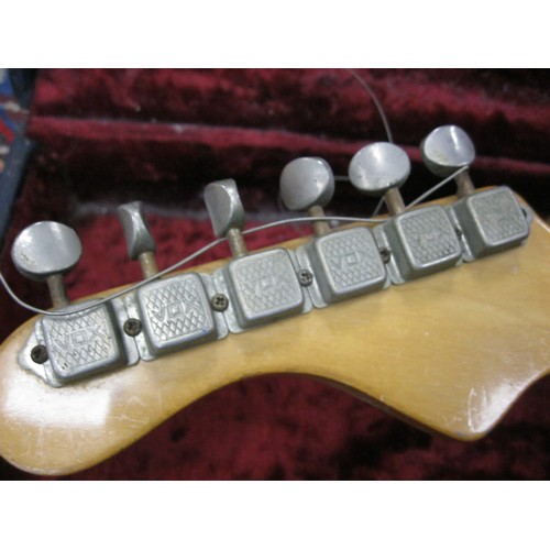 1 - A vintage electric guitar in hard case, head screws by VOX, Burns Tri-Sonic Pickups, in good used or... 