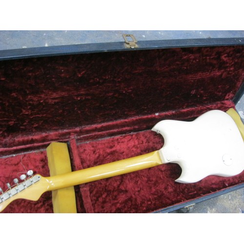 1 - A vintage electric guitar in hard case, head screws by VOX, Burns Tri-Sonic Pickups, in good used or... 