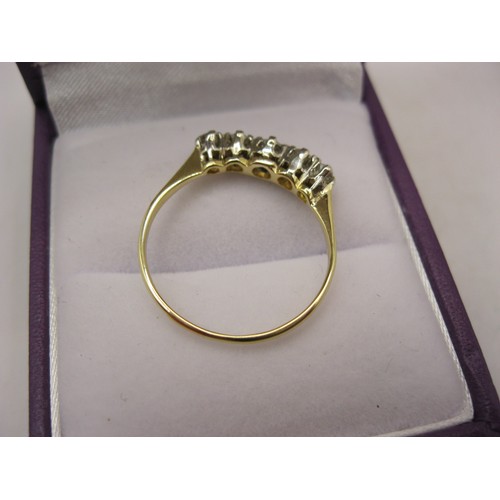 186 - An imposing 18 carat gold ring with 5 clear stones in a platinum mount, size P, approx weight 1.78g