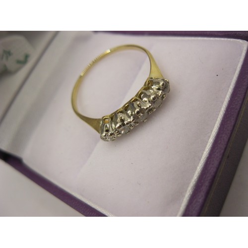 186 - An imposing 18 carat gold ring with 5 clear stones in a platinum mount, size P, approx weight 1.78g