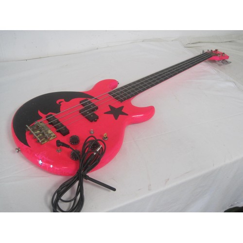 169 - A pink bass guitar with lead