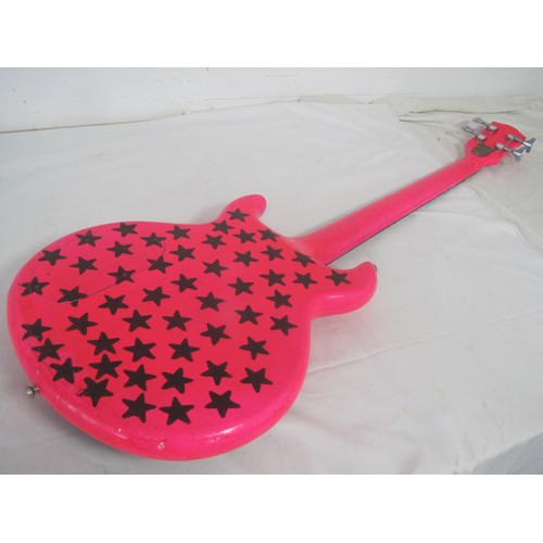 169 - A pink bass guitar with lead