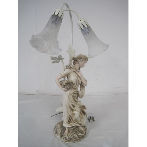 179 - A figural lamp in the form of a woman with two glass tulip lampshades over