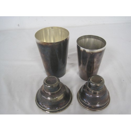 228 - A pair of vintage silver plate cocktail shakers, matching pair, the larger marked for James Deakin &... 