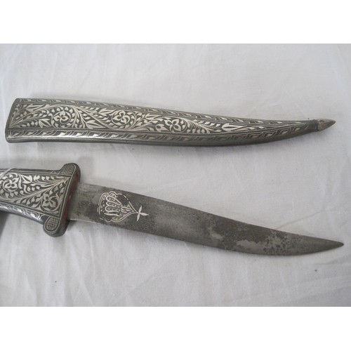 249 - An Indo-Persian niello decorated silver inlaid Panther head dagger in its scabbard. Blade length 19c... 