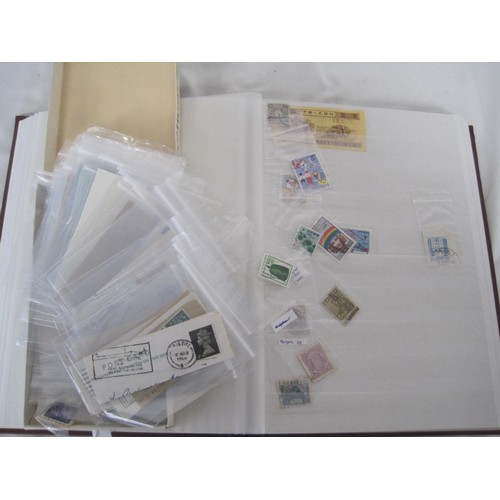 253 - A red stockbook with assorted British and world stamps, and a small box of stamps