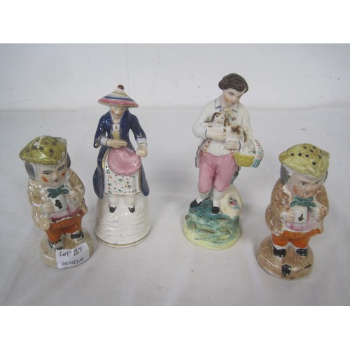 237 - A pair of Staffordshire 'Toby' pepper shakers (height 13.5cm, some a/f paint losses), a pottery figu... 